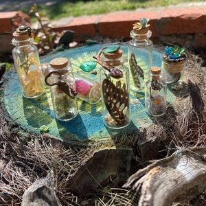 Glass curiosity jars holding beautiful ephemera